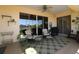 Enjoy the outdoor patio with a ceiling fan and great lighting at 1721 Carrera Dr, The Villages, FL 32159