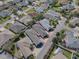 An aerial view shows the location of the house with a defined red line in a well-maintained neighborhood at 1829 Foxwood Ln, The Villages, FL 32162