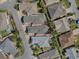 An aerial view shows the location of the house with a defined red line in a Gathering neighborhood at 1829 Foxwood Ln, The Villages, FL 32162