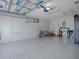 Spacious two-car garage with ample storage space and sealed floors at 1829 Foxwood Ln, The Villages, FL 32162