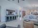 Spacious living room with natural light featuring a sectional sofa, entertainment center, and easy access to other living areas at 1829 Foxwood Ln, The Villages, FL 32162