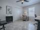 Bright office space featuring tile floors, a ceiling fan, and a storage closet at 1829 Foxwood Ln, The Villages, FL 32162