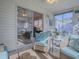 Inviting sunroom with comfortable seating and view of the living area through sliding glass doors at 1829 Foxwood Ln, The Villages, FL 32162