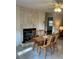 Dining room with decorative stone wall and wood table with seating at 1903 Lake Ella Rd, Fruitland Park, FL 34731