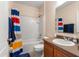 Bright bathroom with a shower-tub combination and a well-lit vanity area at 202 Compass Rose Dr, Groveland, FL 34736