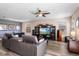 Stylish living room featuring hardwood flooring, a leather sofa, and modern decor at 202 Compass Rose Dr, Groveland, FL 34736