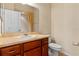 Bathroom with wood cabinets, sink, toilet, and mirror at 3341 Winchester Estates Cir, Lakeland, FL 33810