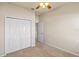 Bedroom with carpet, closet, ceiling fan, and adjacent doorway at 3341 Winchester Estates Cir, Lakeland, FL 33810