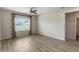 Large bedroom features modern ceiling fan, neutral paint and large window at 3341 Winchester Estates Cir, Lakeland, FL 33810