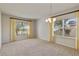 Dining room with lots of windows and a modern chandelier at 3341 Winchester Estates Cir, Lakeland, FL 33810