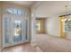 Welcoming foyer leading to the formal living and dining area with lots of natural light at 3341 Winchester Estates Cir, Lakeland, FL 33810