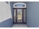 Close up of front door with decorative glass and sidelights at 3341 Winchester Estates Cir, Lakeland, FL 33810