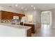 Well-appointed kitchen with ample counter space, island, tile floor, and modern white appliances at 3341 Winchester Estates Cir, Lakeland, FL 33810