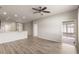 Spacious living room featuring hardwood floors and access to additional living spaces at 3341 Winchester Estates Cir, Lakeland, FL 33810