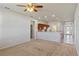 Spacious living room with neutral paint, carpet, and a kitchen view at 3341 Winchester Estates Cir, Lakeland, FL 33810