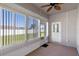 Sunroom with large windows, ceiling fan, and access to the backyard at 3341 Winchester Estates Cir, Lakeland, FL 33810