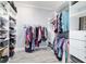 Spacious walk-in closet with built-in shelving and racks provides plenty of storage space for clothes and accessories at 6126 Mulligan Run, The Villages, FL 32163