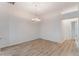 Light-filled dining room with hardwood floors and elegant chandelier at 6200 Topsail Rd, Lady Lake, FL 32159