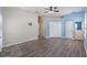 Large living room with white walls, hardwood floors, and closet space at 6200 Topsail Rd, Lady Lake, FL 32159