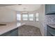 A cozy breakfast nook featuring mosaic tile and modern light fixture at 7549 Frog Log Ln, Leesburg, FL 34748