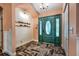 Welcoming foyer with herringbone floors and decorative 'Welcome' sign on the wall at 7549 Frog Log Ln, Leesburg, FL 34748