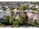 Aerial view showcasing an established neighborhood with mature trees and landscaping, offering a sense of community and charm at 891 Lucky Ln, The Villages, FL 32162