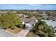 Aerial view of a well-maintained home in a tranquil neighborhood setting at 891 Lucky Ln, The Villages, FL 32162