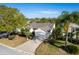 Attractive single-story home featuring a well-kept front yard and long driveway at 891 Lucky Ln, The Villages, FL 32162