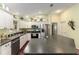 Kitchen with stainless steel appliances, decorative accents, and ample counter space at 891 Lucky Ln, The Villages, FL 32162