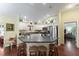 Well-lit kitchen with stainless steel appliances and bar stool seating at the island at 891 Lucky Ln, The Villages, FL 32162