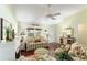 Inviting living room with a fireplace, and light streaming in through the window at 891 Lucky Ln, The Villages, FL 32162