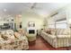 Bright living room with fireplace flows into the kitchen with stainless steel appliances at 891 Lucky Ln, The Villages, FL 32162