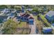 Aerial view of a single Gathering house with a driveway at 910 Rich Dr, Mount Dora, FL 32757