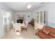 Inviting dining area featuring tile floors, ample natural light, and a cozy seating arrangement perfect for Gathering meals at 910 Rich Dr, Mount Dora, FL 32757