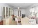 Bright dining room with tile floors, ceiling fan, and neutral decor, creating an inviting space for meals and gatherings at 910 Rich Dr, Mount Dora, FL 32757