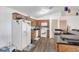 A well-lit kitchen with white appliances, countertop, and cabinetry at 910 Rich Dr, Mount Dora, FL 32757