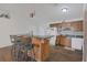 Kitchen with counter seating, wood cabinets, and views to the outdoor space at 910 Rich Dr, Mount Dora, FL 32757