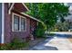 Exterior home with window, landscaping, sidewalk, and driveway at 948 Dora Ave, Tavares, FL 32778