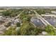 Aerial view showcasing the home's proximity to a scenic park and waterway with a fountain at 952 W Montrose St, Clermont, FL 34711