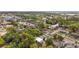 Aerial view of homes surrounded by trees and landscape near the lake at 952 W Montrose St, Clermont, FL 34711