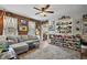 Cozy living room with warm tones, comfortable furniture, and a decorative plant display at 952 W Montrose St, Clermont, FL 34711