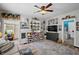 Spacious living room featuring a large window and a door that leads to the outside at 952 W Montrose St, Clermont, FL 34711