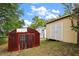 Image features two sheds in the backyard, offering additional storage space at 952 W Montrose St, Clermont, FL 34711