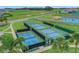 Overhead shot of community pickleball and basketball courts, promising recreation and a great neighborhood vibe at 981 Fiesta Key Cir, Lady Lake, FL 32159