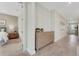 Inviting hallway with wood-look tile floors and a stylish dresser for storage at 981 Fiesta Key Cir, Lady Lake, FL 32159