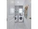 Bright laundry room featuring modern washer and dryer units with decorative accents for added style at 981 Fiesta Key Cir, Lady Lake, FL 32159