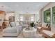 Spacious living room showcasing natural light, comfortable seating, and an open layout to the kitchen at 981 Fiesta Key Cir, Lady Lake, FL 32159