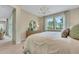 Comfortable main bedroom featuring backyard views, stylish furnishings, and an open layout at 981 Fiesta Key Cir, Lady Lake, FL 32159