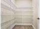 Walk-in pantry with extensive wire shelving for organized storage and easy access to goods at 981 Fiesta Key Cir, Lady Lake, FL 32159