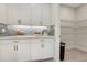 Convenient pantry space with ample storage and countertop, with a decorative backsplash at 981 Fiesta Key Cir, Lady Lake, FL 32159